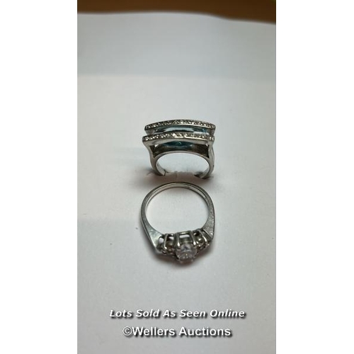 168 - Two rings stamped 925 for silver, one set with blue and white cubic zirconia, ring size N, the other... 