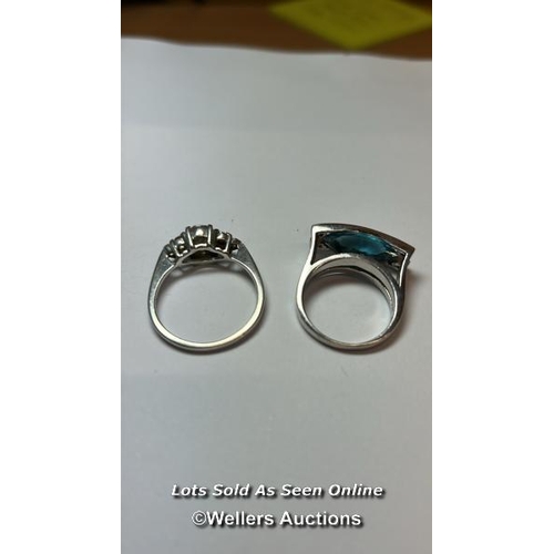 168 - Two rings stamped 925 for silver, one set with blue and white cubic zirconia, ring size N, the other... 