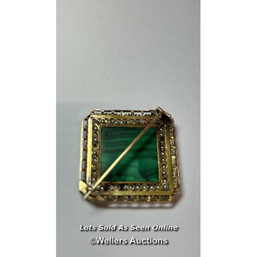 172 - An antique brooch in yellow metal testing as 18ct gold, with centre set with malachite bordered by s... 