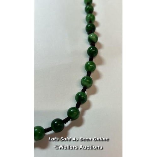 178 - Jade bead necklace string knotted in contrast thread with gold plated hook clasp. Length 60cm, 8-8