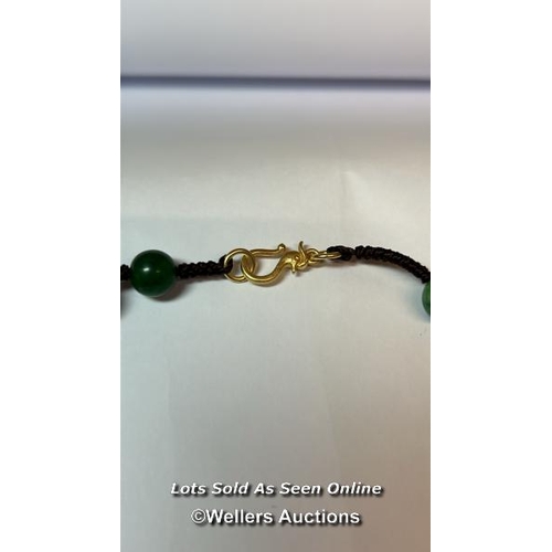 178 - Jade bead necklace string knotted in contrast thread with gold plated hook clasp. Length 60cm, 8-8