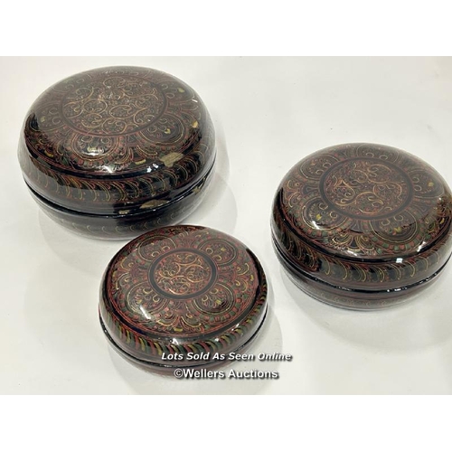 70 - A decorative lacquer ware set of three round boxes, largest 15cm diameter  / AN14