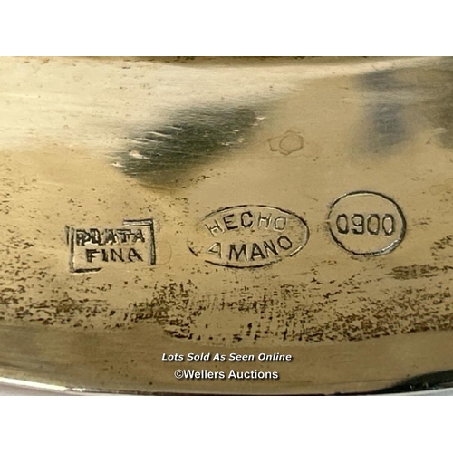 98 - A white metal plate by Hecho Amano stamped 0900 and engraved 