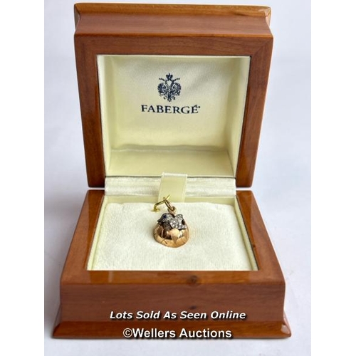 202 - A Faberge style egg pendant with hatching diamond encrusted chick, measuring 20mm x 12mm, the loop w... 