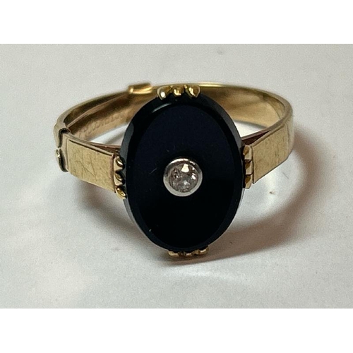 226 - A gents signet ring comprising of oval black onyx set with an old cut diamond to centre, estimated w... 