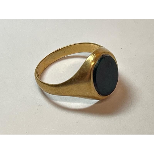 226 - A gents signet ring comprising of oval black onyx set with an old cut diamond to centre, estimated w... 