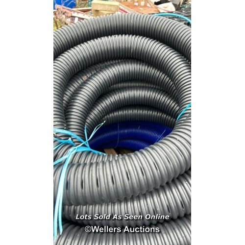 220 - 1X 25M ROLL OF BLUE 100MM FLEXIBLE WATER DUCT AND 1X ROLL OF 80MM PERFORATED COIL DRAIN