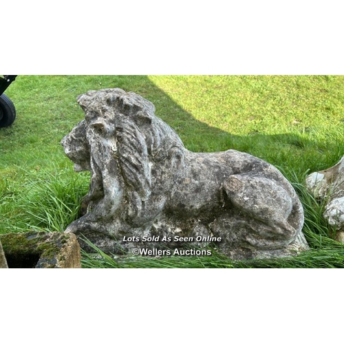 143 - PAIR OF COMPOSITION RECUMBENT LION STATUES, WEATHERED, 70 X 30 X 50CM,