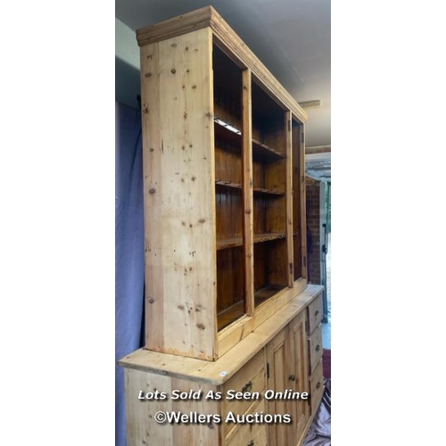 41 - LARGE STRIPPED PINE DRESSER WITH FOUR GLAZED DOORS ON TOP OVER TWO DOORS BELOW AND SIX DRAWERS, 195.... 