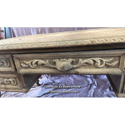 65 - DECORATIVE BLEACHED OAK DESK WITH FOUR DRAWERS ON CARVED LEGS, 130 X 76 X 74.5CM