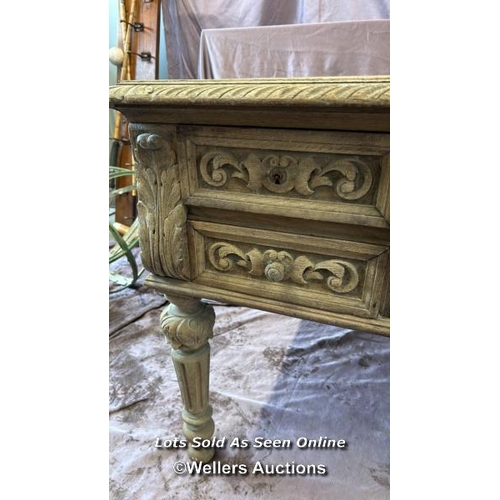 65 - DECORATIVE BLEACHED OAK DESK WITH FOUR DRAWERS ON CARVED LEGS, 130 X 76 X 74.5CM