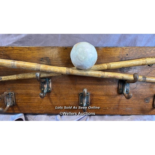 70 - WALL MOUNTED COAT HANGER PLAQUE WITH TWO HORSE POLO STICKS AND BALL, 166.5 X 22CM