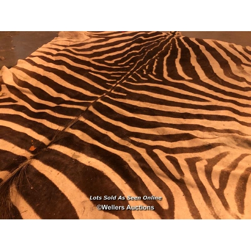 545 - CIRCA 1930 GREVY'S BROWN AND WHITE ZEBRA SKIN RUG, 256 X 170CM