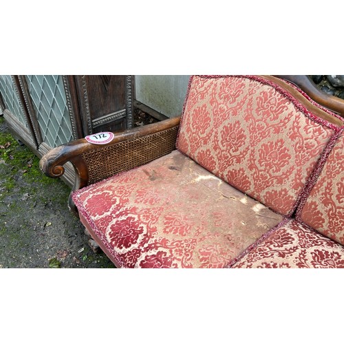 172 - ORNATELY CARVED DOUBLE CANED BERGERE LOUNGE SUITE, IN NEED OF SOME RESTORATION, THREE SEATER SECTION... 