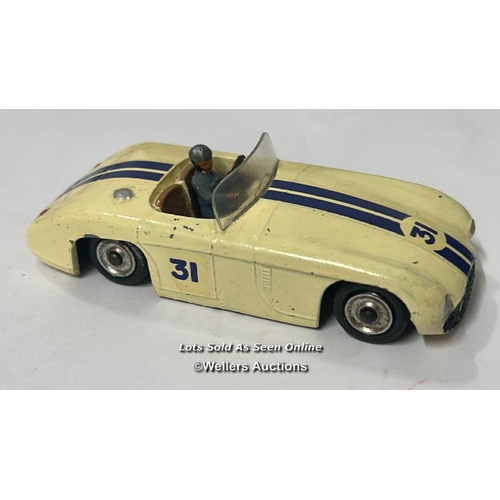 23 - Three vintage diecast cars including Dinky no.133, Cunningham C-5R, off white body with brown interi... 