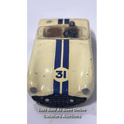 23 - Three vintage diecast cars including Dinky no.133, Cunningham C-5R, off white body with brown interi... 