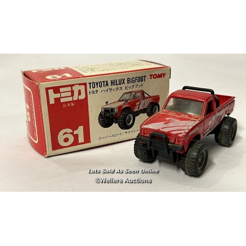 26 - Assorted model vehicles including boxed Tomy Toyota Hilux Bigfoot, Corgi fire truck, Tesco truck and... 