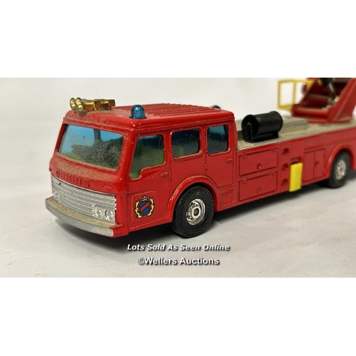 26 - Assorted model vehicles including boxed Tomy Toyota Hilux Bigfoot, Corgi fire truck, Tesco truck and... 