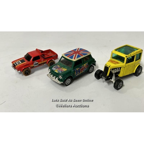 26 - Assorted model vehicles including boxed Tomy Toyota Hilux Bigfoot, Corgi fire truck, Tesco truck and... 