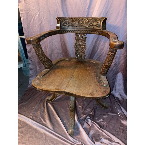 598 - OAK CAPTAINS CHAIR WITH FOLIATE CARVING, 56 X 52 X 81CM