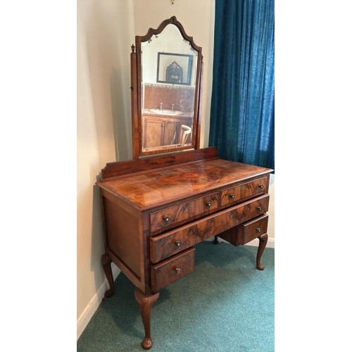 150 - A five drawer walnut dressing table with bevelled mirror, 107 x 78.5 x 50cm, mirror 80cm (collection... 