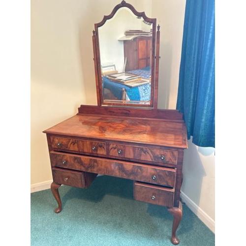 150 - A five drawer walnut dressing table with bevelled mirror, 107 x 78.5 x 50cm, mirror 80cm (collection... 