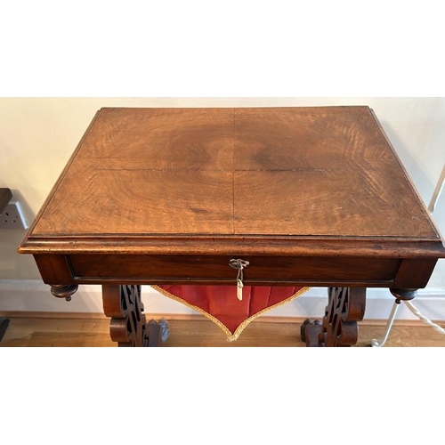 159 - Antique walnut sewing table with sectional interior, clawed feet on casters and working lock with ke... 