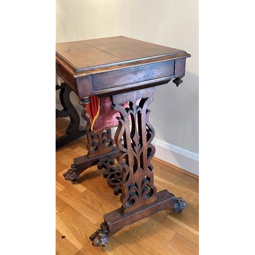 159 - Antique walnut sewing table with sectional interior, clawed feet on casters and working lock with ke... 