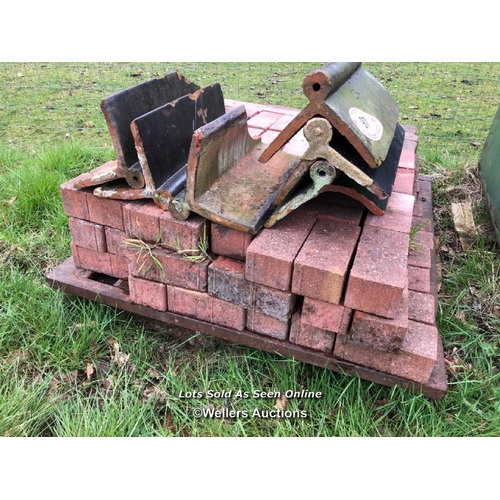 97 - PALLET OF BRICKS OR PAVERS AND FIVE ROLL RIDGE ROOF TILES