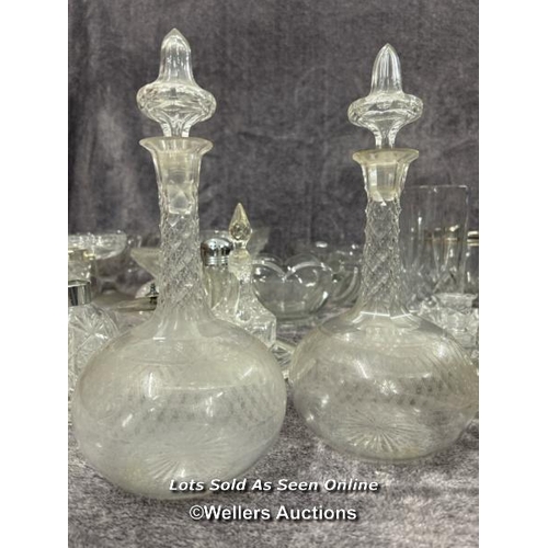 70 - A large collection of glassware including decanters, bowls, vase, rose bowl and cheese dish / AN11