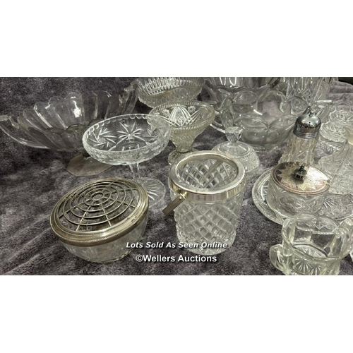 70 - A large collection of glassware including decanters, bowls, vase, rose bowl and cheese dish / AN11