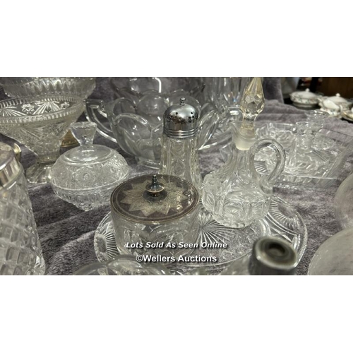 70 - A large collection of glassware including decanters, bowls, vase, rose bowl and cheese dish / AN11