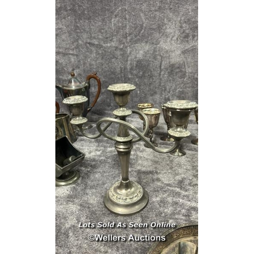 73 - A large collection of antique metal plated items including a three armed candelabra, goblets, brush ... 