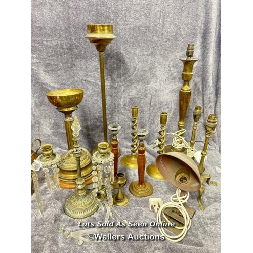 74 - Collection of brass lamps and candle holders including a pair of twisted candle sticks, vintage desk... 