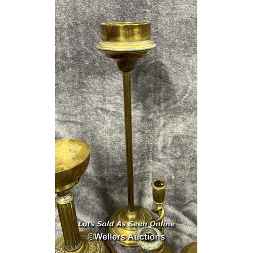 74 - Collection of brass lamps and candle holders including a pair of twisted candle sticks, vintage desk... 