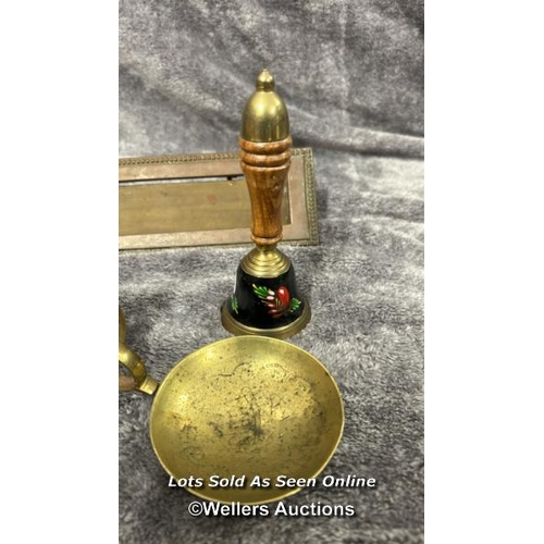 84 - Assorted mainly brass items including candle holders, letter box, bell and door knob with a metal st... 