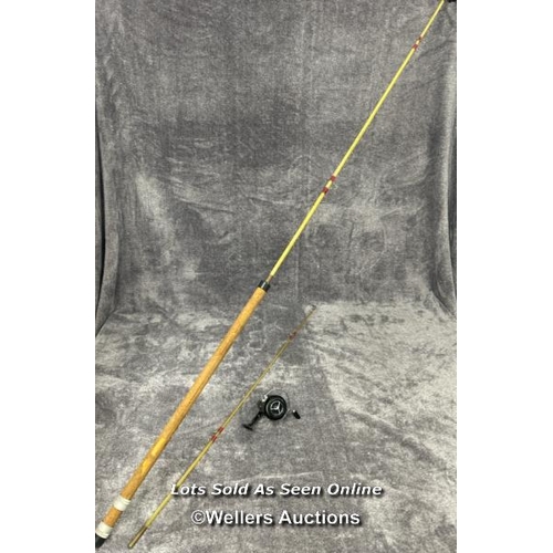 131 - Vintage fibreglass fishing rod with cork handle, 265cm long with a Prince regent reel / AN16