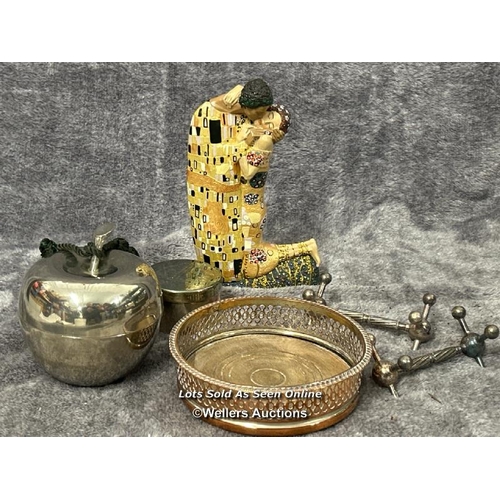 105 - Assorted metalware including apple pot and knife rests with a resin Klimt figurine / AN22