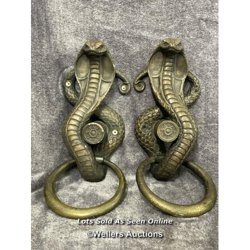 201 - A pair of plaster bronze effect cobra door handles, 46cm high