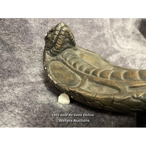 202 - A pair of plaster bronze effect cobra door handles, 46cm high