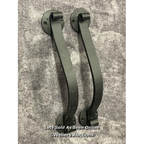 207 - A pair of solid iron door pull handles in scroll form, 36.5cm long