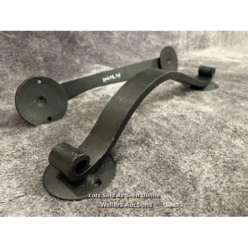 207 - A pair of solid iron door pull handles in scroll form, 36.5cm long