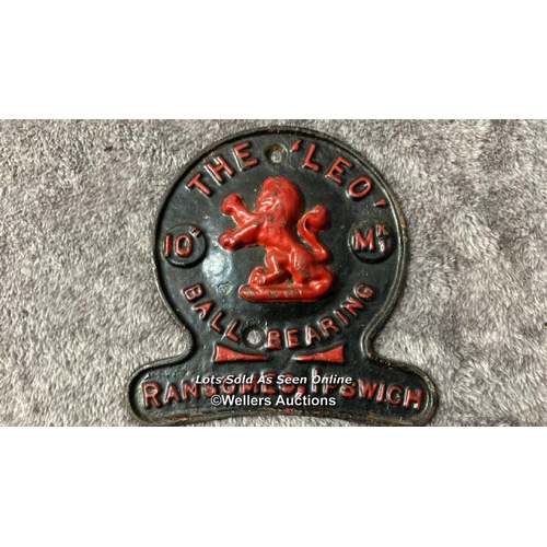 118 - Small cast iron sign 'The Leo Ball Bearing' 13cm wide with a Pooley 2LB weight / AN24