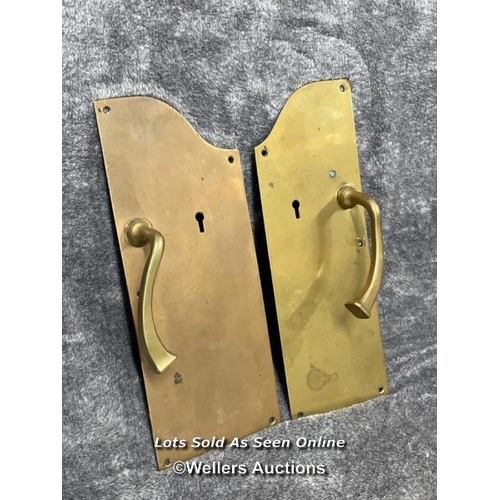 209 - Two similar brass pull handles mounted on shaped back plate, in similar style to those at the famous... 