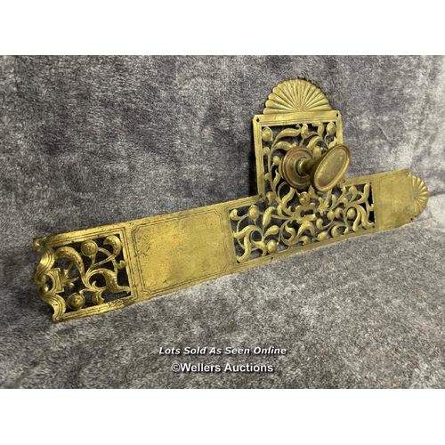 212 - A single brass door handle feature including back plate and handle, 56cm long x 23cm wide