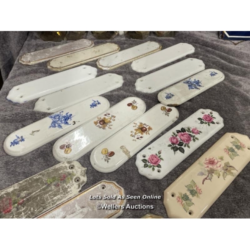 224 - A large selection of thirty ceramic door handle backings, various styles including art deco and vict... 