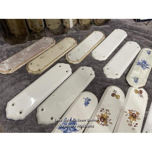 224 - A large selection of thirty ceramic door handle backings, various styles including art deco and vict... 