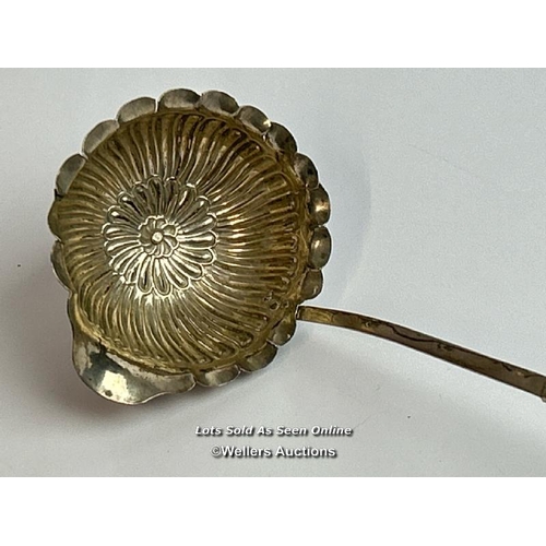 315 - White metal toddy ladle, the bowl shaped as a flower, 35cm long / T42