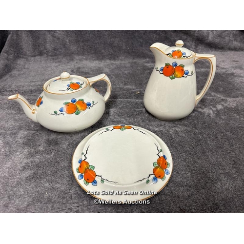 267 - Crown Ducal A1484 pattern jug and teapot with base, pair of Royal Doulton Swan candlesticks and oval... 