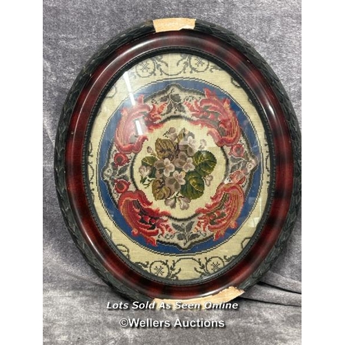 281 - An oval floral tapestry in wooden frame (damaged), 54x63cm